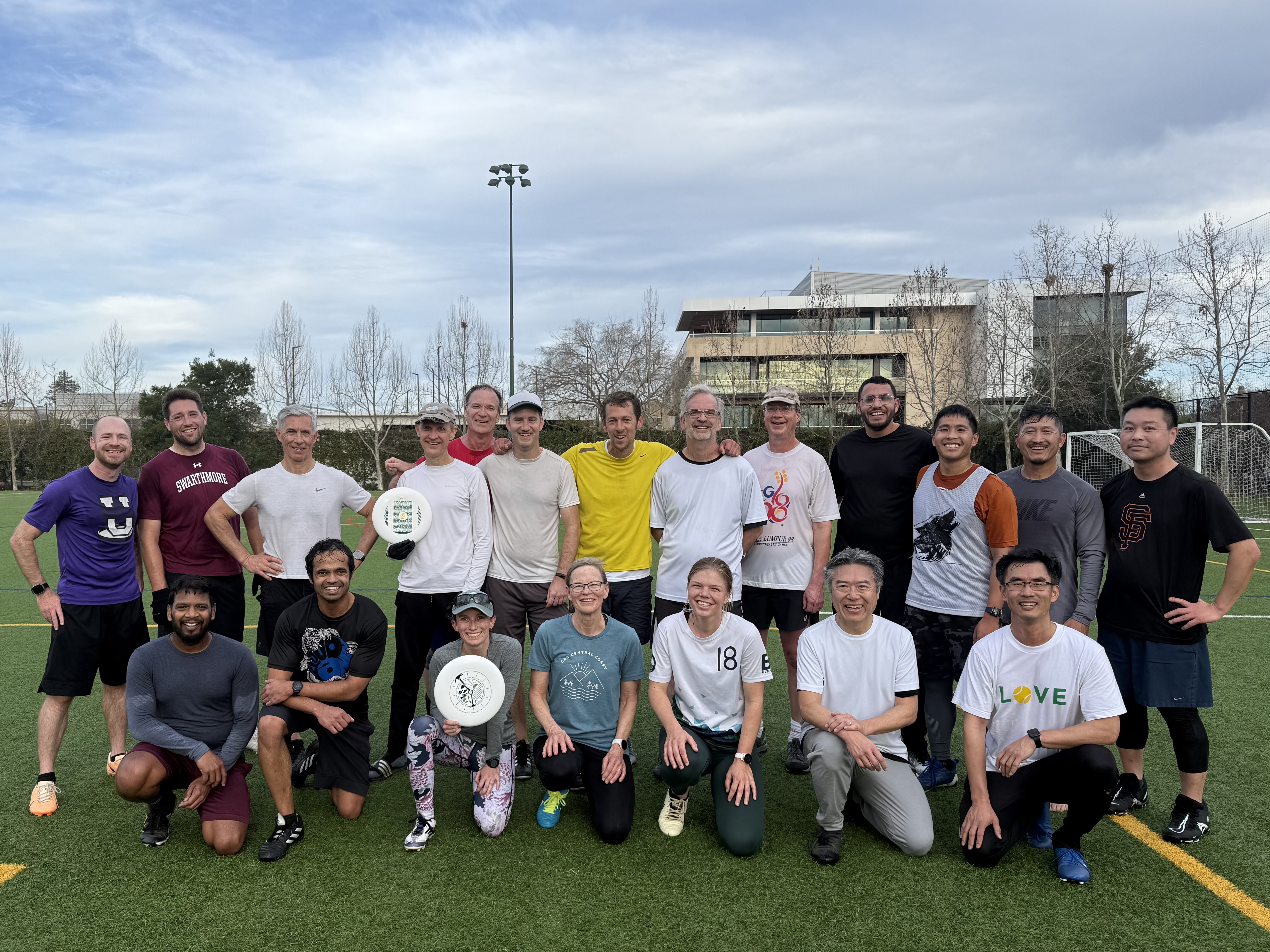 Morning Ultimate players gathered on the turf after a game